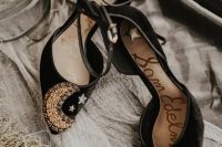 amazing black velvet heels with embellished stars and a moon for a celestial wedding
