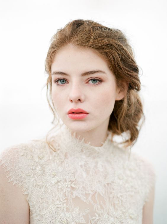 an apricot wedding makeup with a pink lip, a touch of peachy eyeshadow, a very slight touch of blush