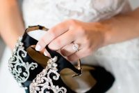 black shoes with embellishments and high heels plus ankle straps and peep toes are an amazing idea for a Halloween wedding