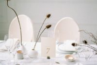 dried flowers in simple matte white vases will be a nice decoration with a subtle fall feel