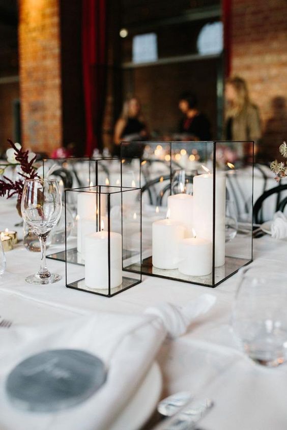 geometric black candle lanterns with white pillar candles are all that you need to create a mood and add to the decor