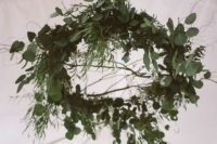 lush and textural greenery chandeliers are trendy decorations for receptions and ceremony spaces