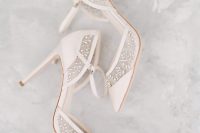 neutral super delicate wedding shoes with straps and lovely embellishments with a botanical pattern are gorgeous