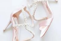 pink strappy wedding shoes with beautiful embellishments for a delicate yet shiny look and a subtle touch of color