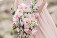 a beautiful and chic blush wedding bouquet of peony roses and some cascading greenery is a beautiful idea to rock