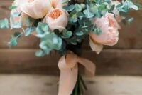 a blush peony rose wedding bouquet with eucalyptus and matching ribbons is a lovely and very girlish bouquet idea