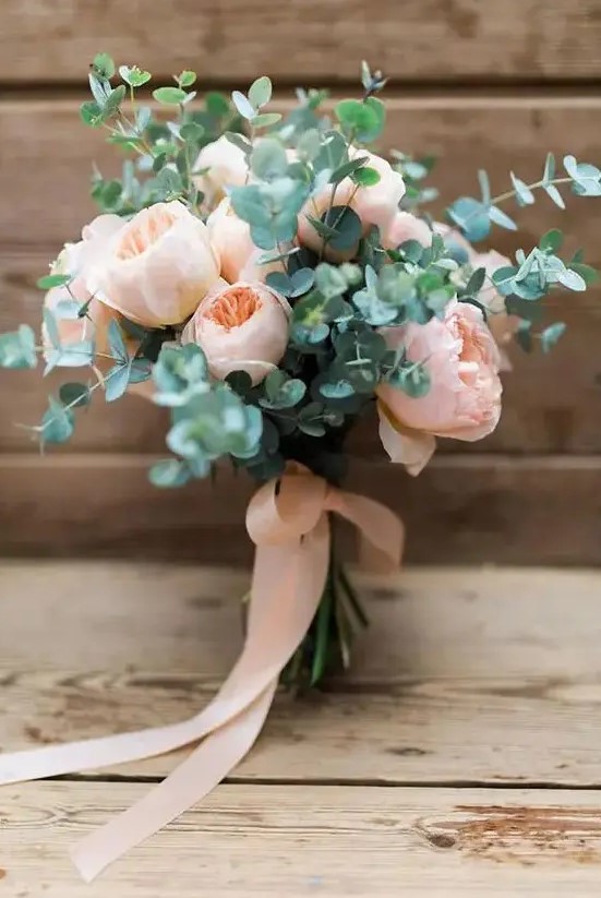 a blush peony rose wedding bouquet with eucalyptus and matching ribbons is a lovely and very girlish bouquet idea