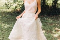 a blush spaghetti strap top and a white lace A-line maxi skirt and neutral heels for a modern or casual bride