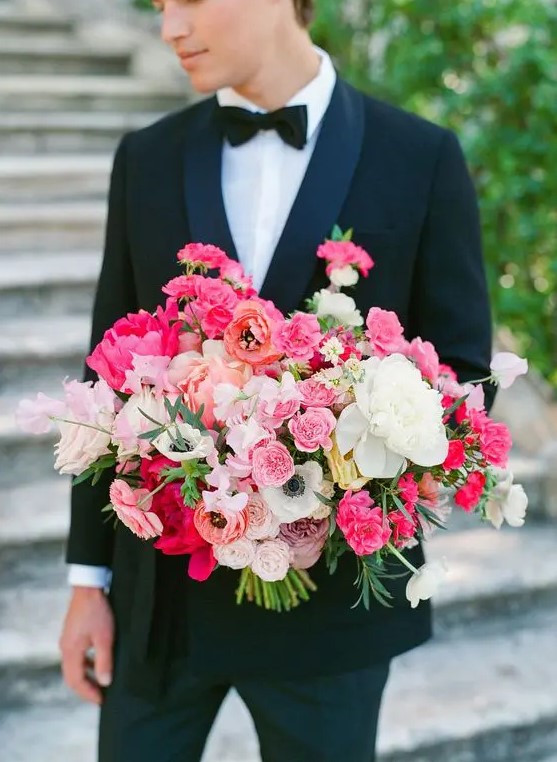 a bold and elegant wedding bouquet with white, light and hot pink blooms, orange flowers and greenery is a fantastic idea to add color to the bridal look