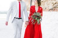 a bold red A-line wedding dress with a lace bodice, long sleeves and a plain skirt is a stylish and cool idea
