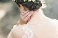 a braided side updo with a simple top and a fresh flower hairpiece is great for a delicate and a bit boho infused bride