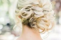 a curly side updo with some locks down for a elegant and effortless feel is a very chic and stylish beach and not only beach wedding idea