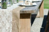 a double wedding table runner of burlap and lace is a cool idea to DIY and it will give a proper rustic feel to the table
