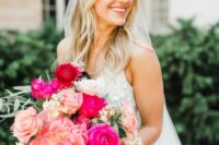 a hot pink and light pink wedding bouquet with some greenery is a lovely spring and summer wedding idea with plenty of color