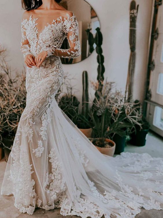 a jaw-dropping lace applique mermaid wedding dress with an illusion neckline, long sleeves, a train is a chic and lovely idea