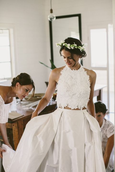 a lace halter neckline crop top and a full pleated maxi skirt for a unique and very eye-catchy bridal look