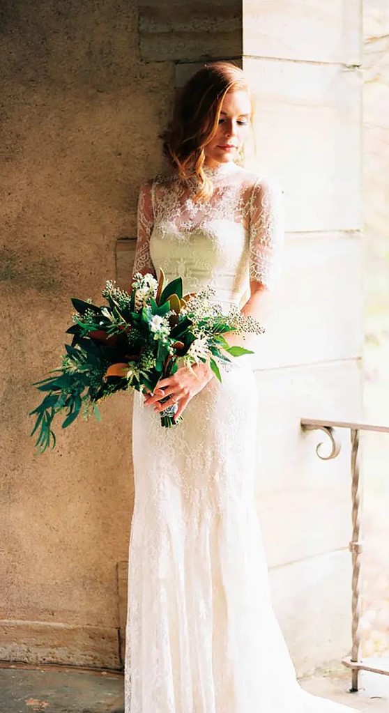 a lace sheath wedding dress with short sleeves, an illusion neckline for a modest and romantic bride
