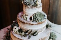 a lovely naked wedding cake decorated with succulents, thistles and white blooms is a beautiful idea for a spring or summer wedding