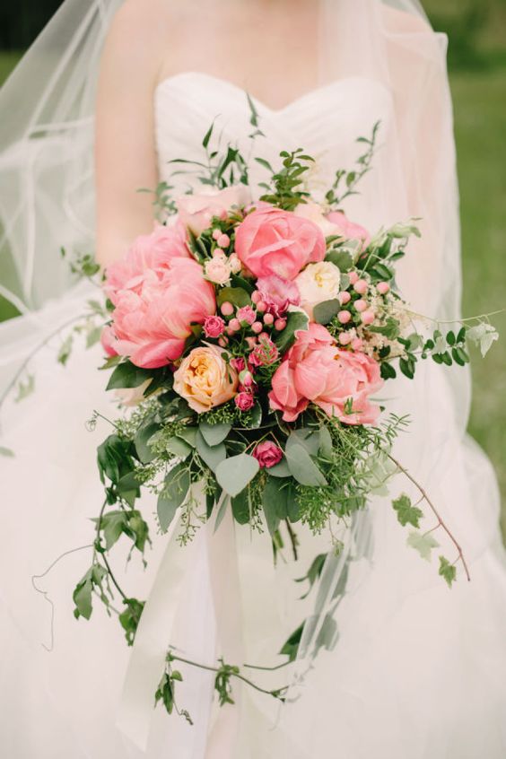 a lovely summer wedding bouquet with peonies, berries, garden roses, greenery and ribbon is a stylish and timeless idea