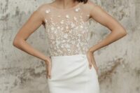 a modern wedding dress with a nude lace applique bodice with an illusion neckline, a sleek plain skirt with a slit is cool