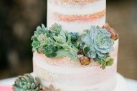 a naked wedding cake decorated with succulents of various colors and looks is a pretty and simple solution for a rustic wedding