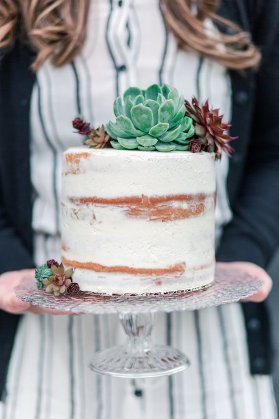 a naked wedding cake decorated with various succulents is a cool solution for a rustic or some other wedding, and you may add this decor yourself