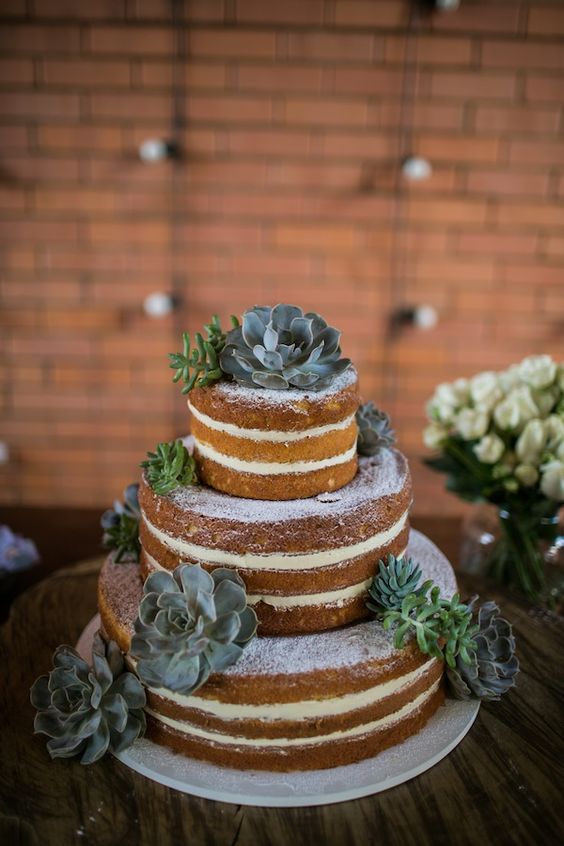 a naked wedding cake decorated with various succulents is classics for a laid-back or rustic wedding, such a combo always looks good