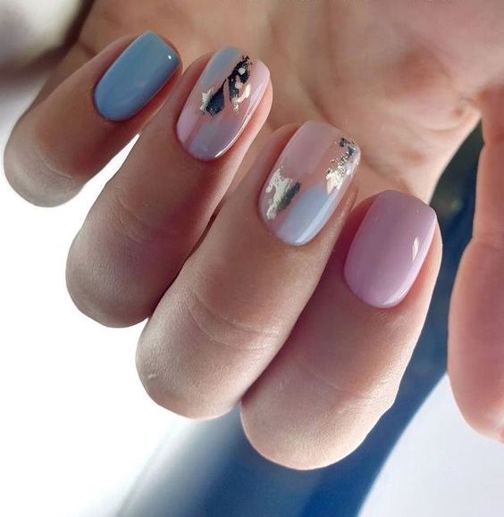 a pastel wedding manicure with pink, peachy pink, blue nails and touches of watercolor and gold foil is amazing