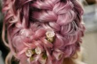 a pink braided wedding updo with some fresh garden roses and waves down for a pciture-perfect look