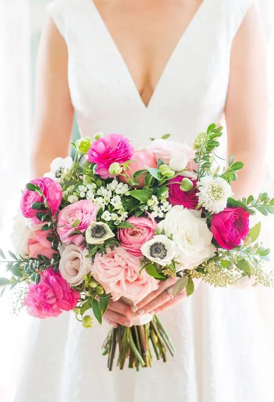 a refined and contrasting wedding bouquet of white, light and hot pink blooms, greenery and bouquet fillers is a lovely idea