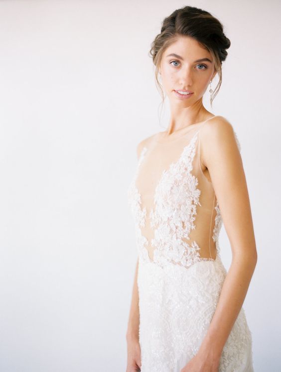 a refined sheath wedding dress with lace applique and an illusion neckline, no sleeves is a beautiful idea