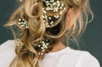 a romantic tousled bridal braid adorned with baby’s breath will be a nice option for a spring or summer bride