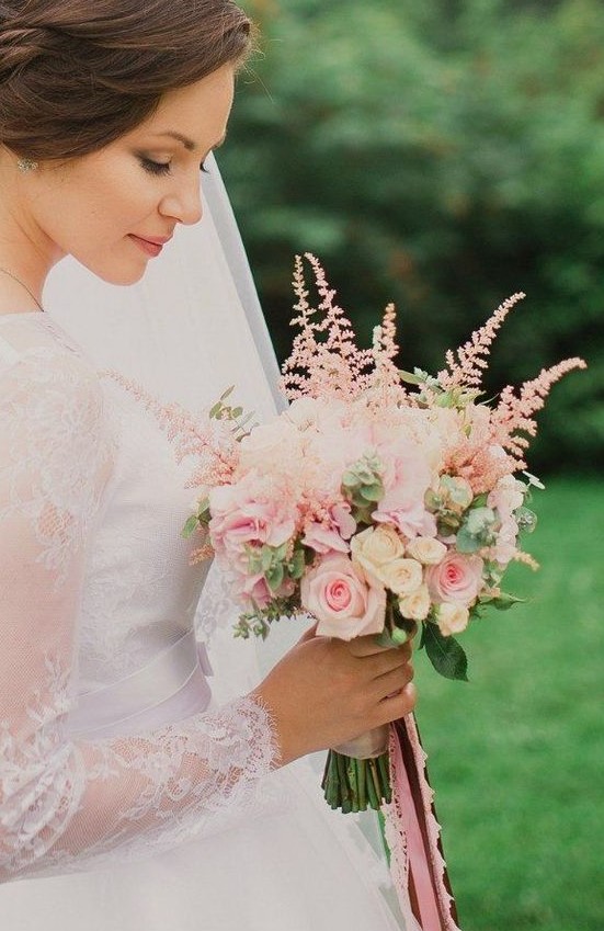 a romantic wedding bouquet with pink and neutral roses, eucalyptus, pink astilbe is a lovely and very beautiful idea