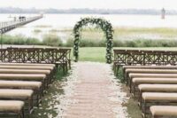 a rustic burlap aisle runner paired with petals is a great idea for a rustic celebration