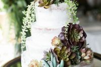 a gorgeous semi-naked wedding cake with succulents