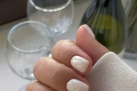 a super delicate pastel wedding manicure done in tan and light green shades is a great idea for a spring bride
