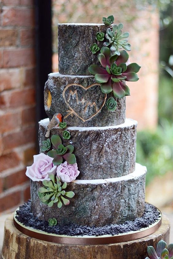 a tree-looking wedding cake with green sugar succulents and lilac sugar blooms plus a cutout decoration is a lovely idea for a woodland wedding