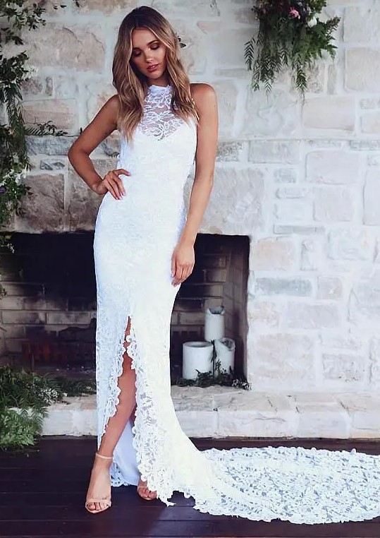 an illusion halter neckline lace wedding dress with an illusion neckline and a front slit plus a train