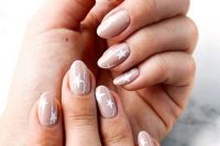 blush wedding nails with large white stars look cute, a bit imperfect and very dreamy