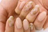 delicate blush wedding nails with gorgeous gold glitter stars are a nice idea for a celestial bride in spring and not only