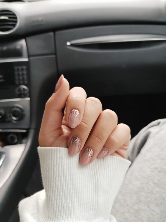 dusty pink nails with a bit of glitter is a beautiful idea of a wedding manicure, with a touch of glam and shine