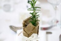 herbs wrapped in burlap, with a bow and a card are an amazing idea for a wedding favor