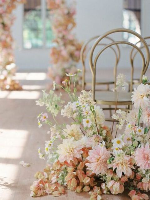 lovely and chic spring wedding aisle decor with pink, blush and white floral arrangements is ideal for a spring wedding with a bit of color