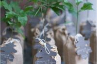 mini trees wrapped in burlap, with leaf-shaped cards are amazing as wedding favors, can be rocked at a woodland or rustic wedding