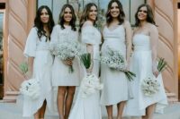 mismatching creamy mini and midi bridesmaid dresses will give your bridal party a fresh and edgy touch