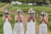 mismatching white boho lace bridesmaid dresses will fit a boho wedding and will help you pull off a trendy mismatching look
