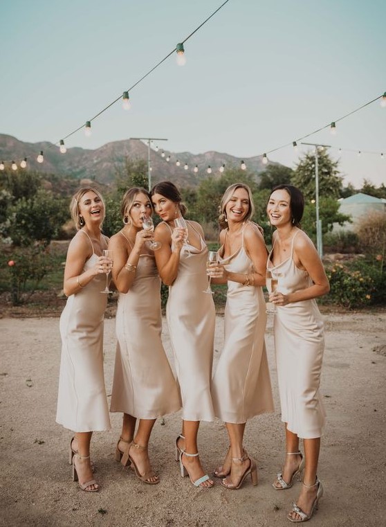 neutral silk slip midi bridesmaid dresses are chic, simple and will never go out of style