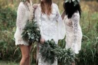 short white boho lace bridesmaid dresses with long bell sleeves for a trendy white bridal party at a boho wedding