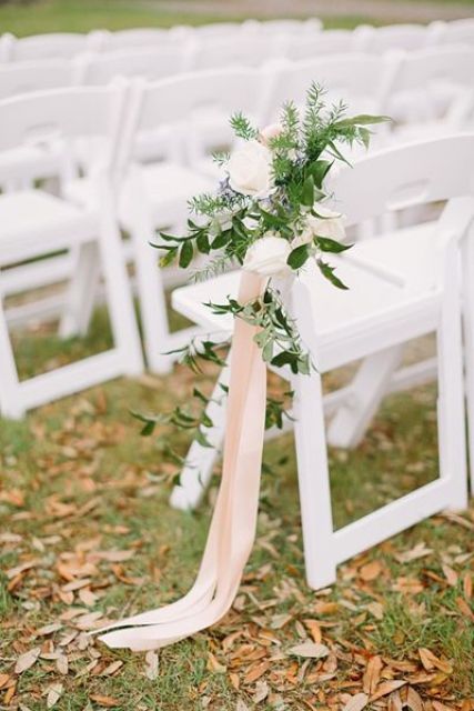 subtle spring wedding aisle decor with white roses, textural greenery and long blush ribbons is a very stylish and delicate idea