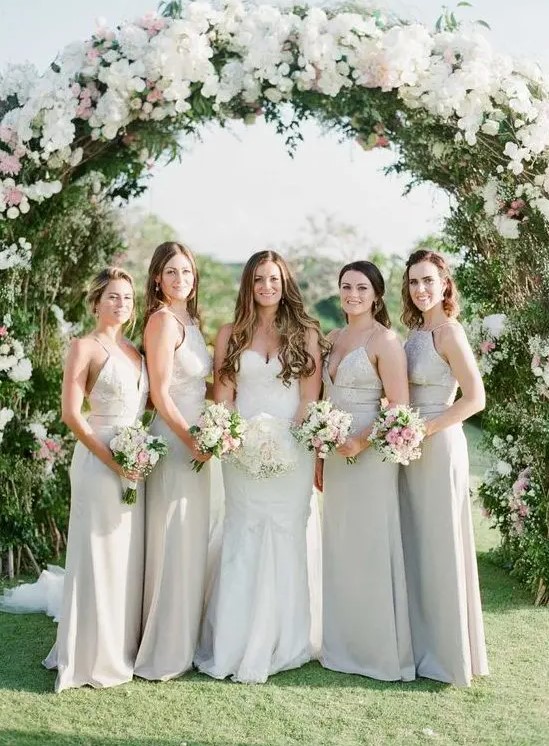 white mismatching maxi bridesmaid dresses will help the gals feel more comfortable on a hot day